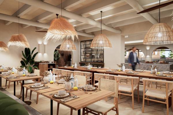 Hotelrestaurant mit Holztischen und Stühlen, dekorativen Lampenschirmen aus Naturmaterialien und gedeckten Tischen in modernem, hellem Ambiente
